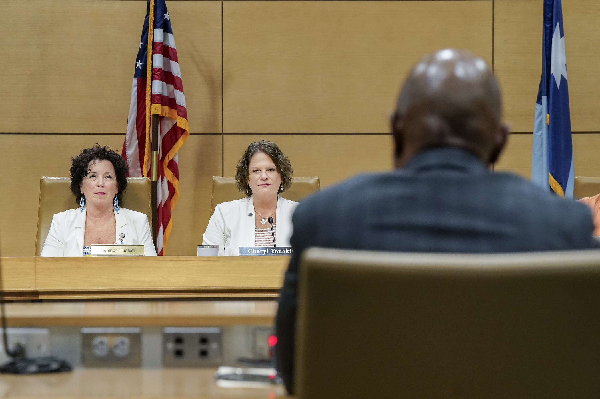 Sen. Mary Kunesh and Rep. Cheryl Youakim, co-chairs of the K-12 education working group, listen to comments from Education Commissioner Willie Jett before a June 2 walkthrough of the group’s agreement. (Photo by Michele Jokinen)
